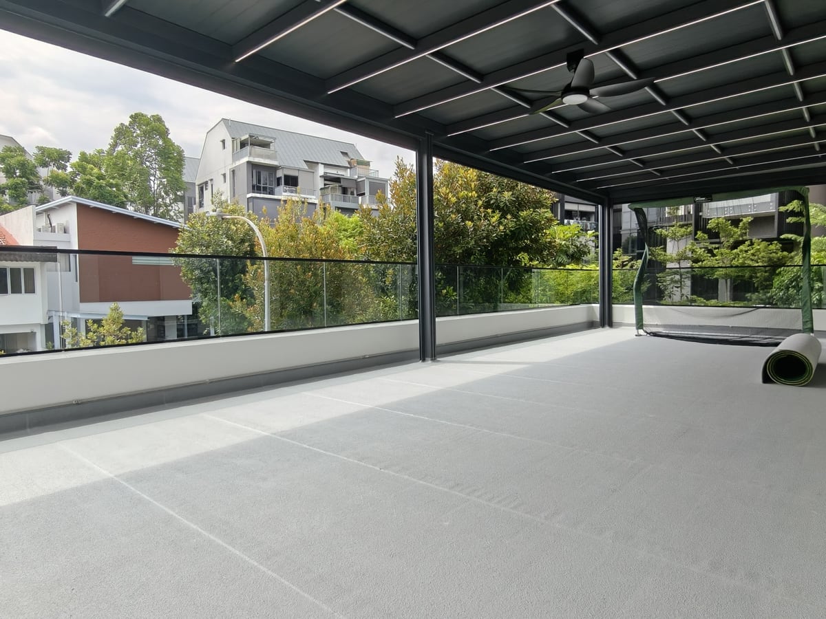 Aluminium smart roof shelter over an outdoor terrace in Singapore